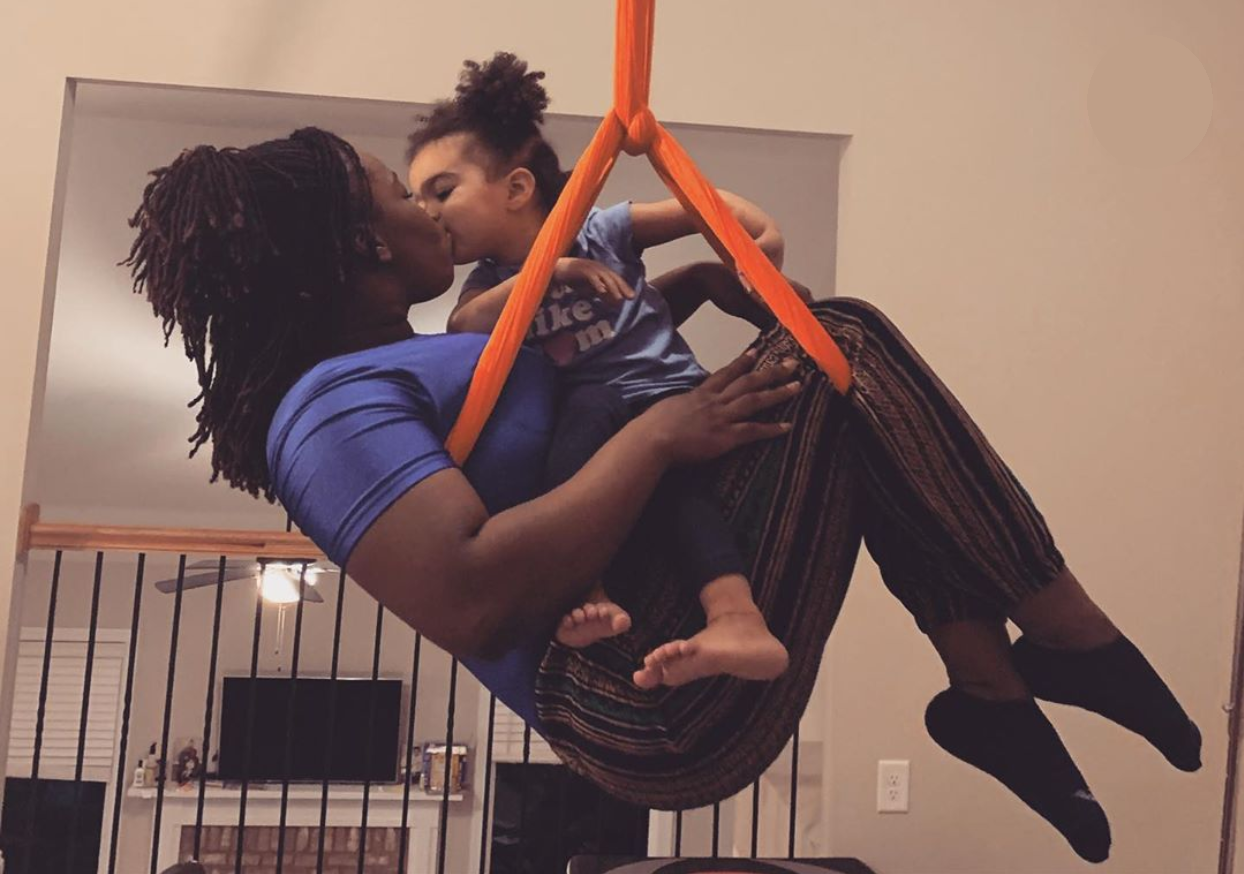 Expecting moms take the load off with aerial yoga