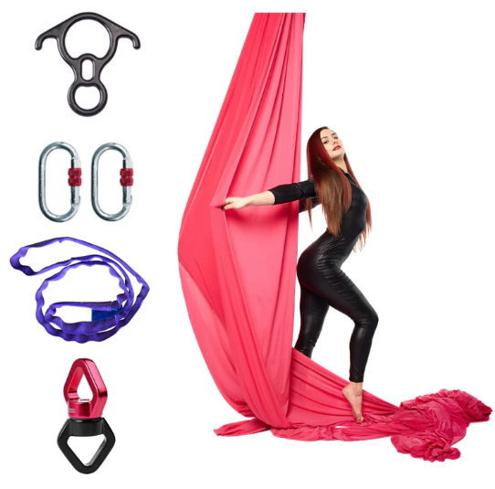 Woman doing aerial yoga with pink silk and all the components that come with the aerial silk and hardware set.