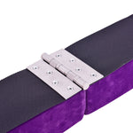 The hinges of a purple sectional floor balance beam.